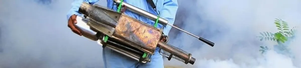 Fumigation technician using a fogger for deep pest treatment in Pembroke PInes, FL